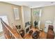 Bright living room with a cozy fireplace, hardwood floors, and ample natural light from large windows at 3304 W Harbor View Ave, Tampa, FL 33611