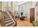 Spacious living room featuring a fireplace, staircase, high ceilings, and ample natural light at 3304 W Harbor View Ave, Tampa, FL 33611