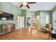 Large primary bedroom with a ceiling fan, sitting area, and ensuite bathroom access at 3304 W Harbor View Ave, Tampa, FL 33611