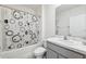 Bathroom featuring a tub-shower combo with a stylish patterned shower curtain and vanity sink at 33657 Field Maple Loop, Wesley Chapel, FL 33545