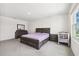 Spacious main bedroom with a king-size bed, ample closet space, and plenty of natural light at 33657 Field Maple Loop, Wesley Chapel, FL 33545