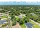 Overhead view of a home surrounded by verdant landscaping in a tranquil, residential setting at 3682 Johnstown St, North Port, FL 34288