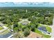 Birds-eye view of a beautiful home nestled in a peaceful, tree-lined community with ample space at 3682 Johnstown St, North Port, FL 34288