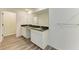 Bathroom features a dual vanity with granite countertops, white cabinetry, and modern fixtures at 3682 Johnstown St, North Port, FL 34288