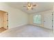 Neutral bedroom with carpet, a ceiling fan and a window with blinds at 3682 Johnstown St, North Port, FL 34288