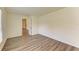 Bedroom with wood-look floors, neutral walls, and natural light at 3682 Johnstown St, North Port, FL 34288