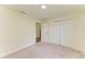 Bright bedroom with plush carpet, neutral walls, and a double door closet at 3682 Johnstown St, North Port, FL 34288