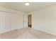 Carpeted bedroom featuring a double door closet and neutral walls at 3682 Johnstown St, North Port, FL 34288