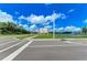 Community entrance sign with a well-maintained landscape and a view of the pond at 3682 Johnstown St, North Port, FL 34288