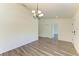 Empty dining room featuring modern floors, a chandelier, and natural light from a window at 3682 Johnstown St, North Port, FL 34288