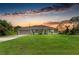Beautiful single-story home with a well-manicured lawn and a spacious two-car garage at 3682 Johnstown St, North Port, FL 34288