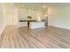 Open-concept kitchen featuring granite countertops and modern stainless steel appliances at 3682 Johnstown St, North Port, FL 34288