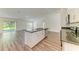 Open kitchen with an island, granite countertops, and stainless steel appliances at 3682 Johnstown St, North Port, FL 34288