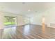 A living room with sliding glass doors that showcase backyard views and abundant natural light at 3682 Johnstown St, North Port, FL 34288