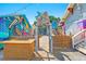 Inviting entrance with a custom-designed sign and artistic decor, adding character and charm to the property at 3940 Miramar S Way, St Petersburg, FL 33705
