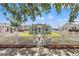 Charming light blue home with white picket fence and manicured front yard at 3940 Miramar S Way, St Petersburg, FL 33705