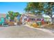 Unique exterior featuring colorful columns and a covered patio, creating a vibrant and inviting atmosphere at 3940 Miramar S Way, St Petersburg, FL 33705
