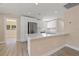 Bright kitchen featuring stainless steel appliances, white cabinets and a spacious island at 3940 Miramar S Way, St Petersburg, FL 33705
