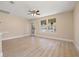 Open concept living room with plenty of light and new wood flooring at 3940 Miramar S Way, St Petersburg, FL 33705