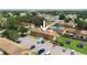 Aerial shot showcasing this townhome, surrounded by lush greenery and ample parking spaces at 4008 Pine Limb Ct, Tampa, FL 33614