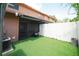This is a fenced in back yard, with artificial turf and privacy at 4008 Pine Limb Ct, Tampa, FL 33614