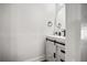 Bathroom featuring a white vanity with round mirror at 4008 Pine Limb Ct, Tampa, FL 33614