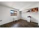 Bright bedroom featuring wood floors, a window, and a closet with shelving at 4008 Pine Limb Ct, Tampa, FL 33614