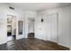 Comfortable bedroom with wood floors, ample closet space, and access to the ensuite bathroom at 4008 Pine Limb Ct, Tampa, FL 33614