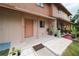 Charming townhome with a quaint porch and appealing landscaping at 4008 Pine Limb Ct, Tampa, FL 33614