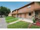 Exterior view of townhomes with well-maintained lawns and sidewalks at 4008 Pine Limb Ct, Tampa, FL 33614