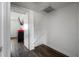 Hallway with door, stairway, and dark wood-look floors at 4008 Pine Limb Ct, Tampa, FL 33614