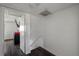 Hallway with door, stairway, and dark wood-look floors at 4008 Pine Limb Ct, Tampa, FL 33614