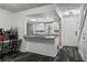 Kitchen with white cabinets, granite countertops, stainless steel appliances, and a window over the sink at 4008 Pine Limb Ct, Tampa, FL 33614