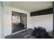 This is a screened in porch with room for fun and a sliding door to the inside at 4008 Pine Limb Ct, Tampa, FL 33614