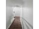 Stairway going down with white walls and brick flooring at 4008 Pine Limb Ct, Tampa, FL 33614