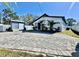 Spacious backyard featuring a shed, modern deck, and beautiful landscaping at 4029 9Th S Ave, St Petersburg, FL 33711