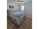 Cozy bedroom featuring natural light, hardwood floors, and a stylish bed at 4029 9Th S Ave, St Petersburg, FL 33711