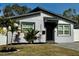 Charming single-story home featuring a well-manicured lawn and a freshly painted facade at 4029 9Th S Ave, St Petersburg, FL 33711