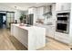 Modern kitchen featuring white cabinets, stainless steel appliances, and a large island at 4029 9Th S Ave, St Petersburg, FL 33711