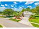 Stunning single-Gathering home features a well-manicured lawn, lush landscaping, and an attached two-car garage at 4495 Secretariat Run, Spring Hill, FL 34609