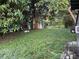 Spacious backyard with a shed, lush greenery, and plenty of room for outdoor activities at 4591 54Th N Ave, St Petersburg, FL 33714