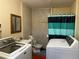 Combined laundry and bathroom with a washing machine, dryer, toilet, and sink at 4591 54Th N Ave, St Petersburg, FL 33714