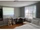 Bright bedroom with a desk space and white curtains for a clean, modern feel at 4591 54Th N Ave, St Petersburg, FL 33714