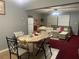 Inviting living room with neutral colors, a ceiling fan, and a decorative dining table set at 4591 54Th N Ave, St Petersburg, FL 33714