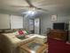Spacious living room offering comfortable seating, ceiling fan, and ample natural light for a welcoming atmosphere at 4591 54Th N Ave, St Petersburg, FL 33714