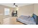 Comfortable bedroom with a ceiling fan, desk, and a bed with stylish bedding at 4617 Basswood St, Land O Lakes, FL 34639