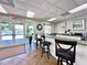 Community clubhouse features a bar area and view of the pool outside at 4617 Basswood St, Land O Lakes, FL 34639