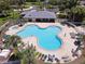 Beautiful community pool with spacious deck, lounge chairs, and well-maintained landscaping at 4617 Basswood St, Land O Lakes, FL 34639