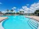 Expansive community pool featuring a large swimming area, comfortable lounge chairs, and well-maintained surroundings at 4617 Basswood St, Land O Lakes, FL 34639
