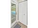 Bright entrance featuring a glass door leading to the pool area and a built in storage closet at 4617 Basswood St, Land O Lakes, FL 34639